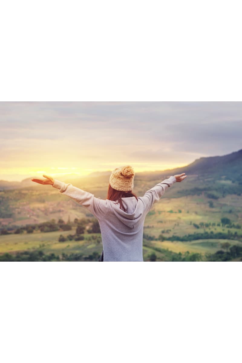 Sustainable hoodies - woman welcoming the sunrise
