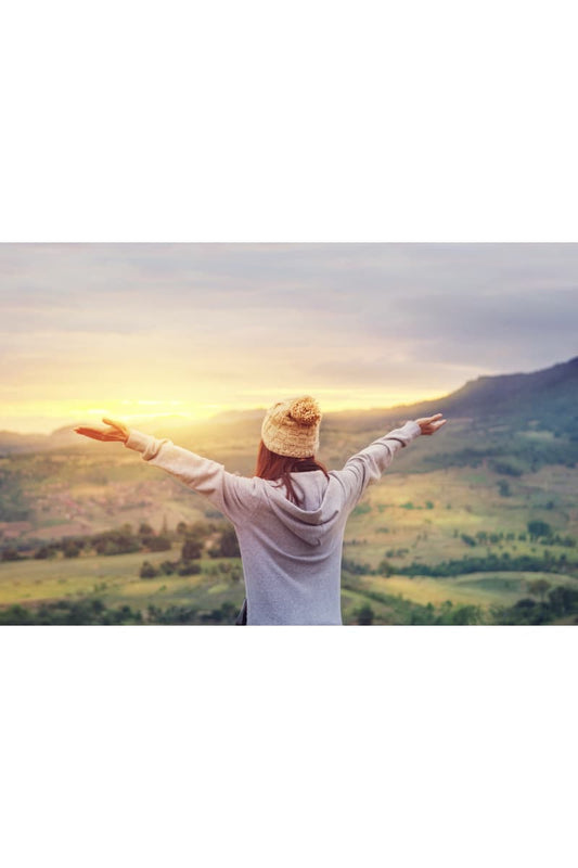 Sustainable hoodies - woman welcoming the sunrise