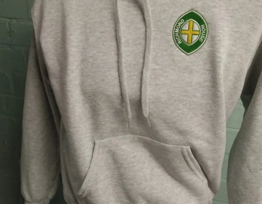 Grey custom university hoodie with embroidered school logo.